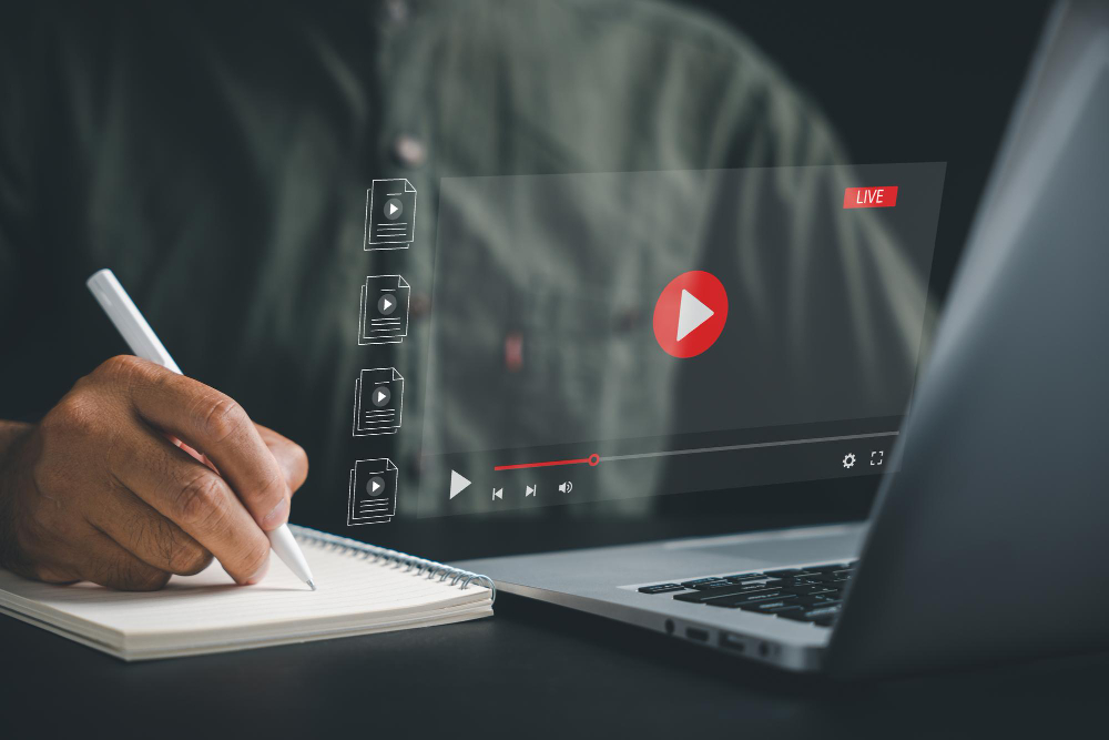 man writing - pros and cons of youtube automation