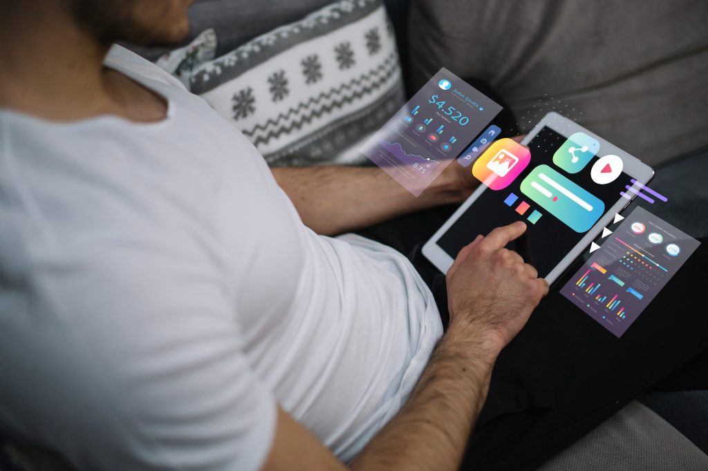 man with a tablet - pros and cons of youtube automation