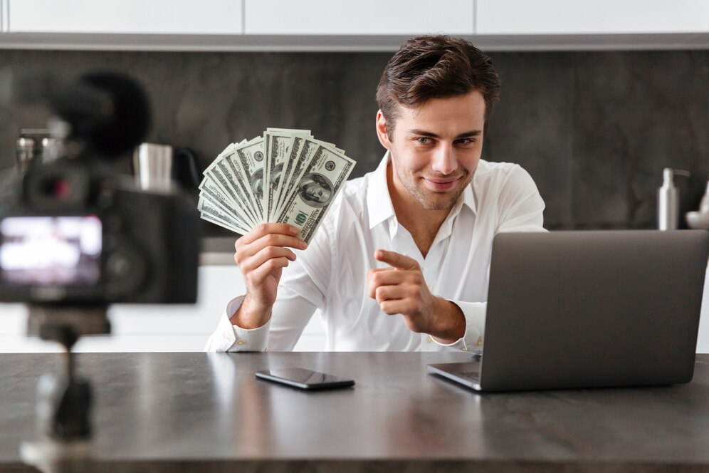 man with dollar bills - What is YouTube Automation